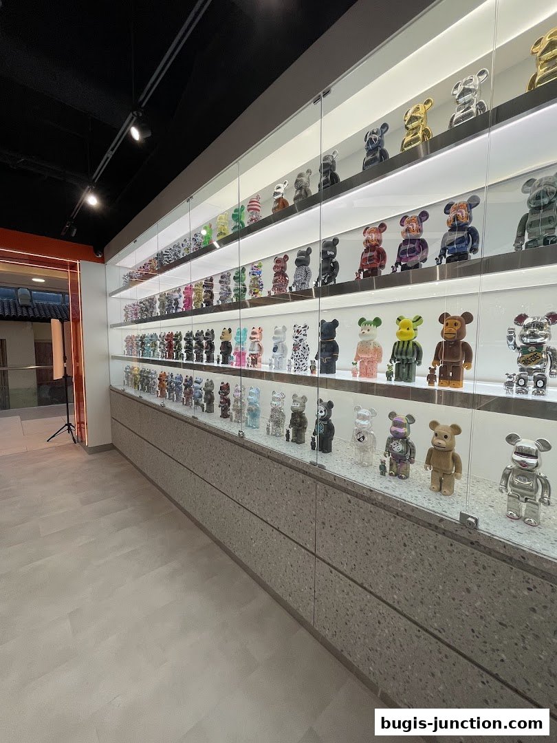 A display of numerous collectible designer toys in a brightly lit retail store.