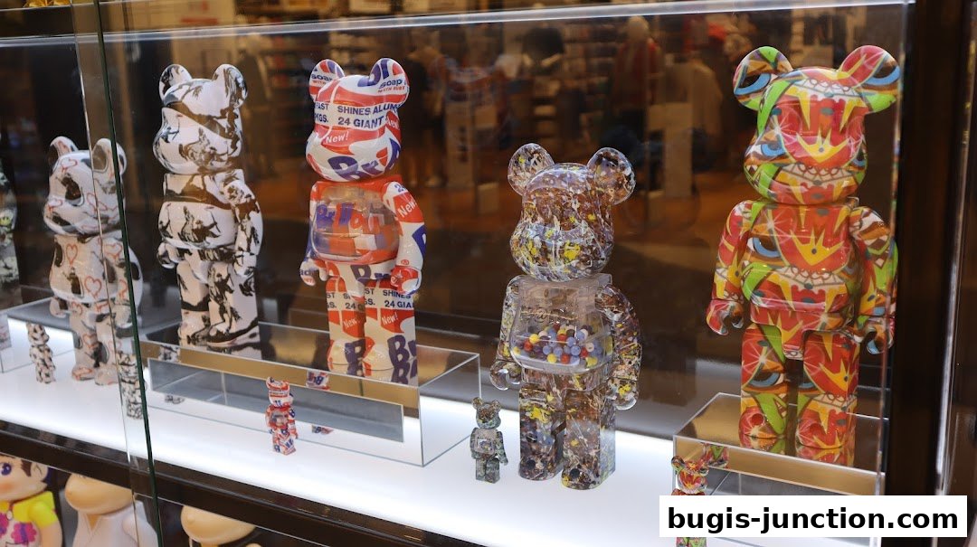 A display of colorful and patterned designer bear figurines in a shop window.