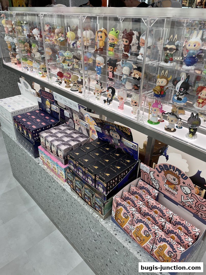 A display of collectible designer toys and blind boxes in a retail store.