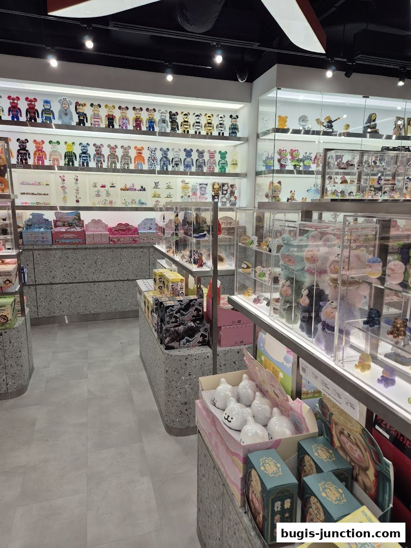Interior view of ActionCity Bugis Junction showcasing shelves filled with collectible toys and figures.