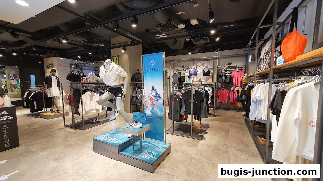 Interior view of an Adidas Performance Store showcasing athletic apparel and footwear.