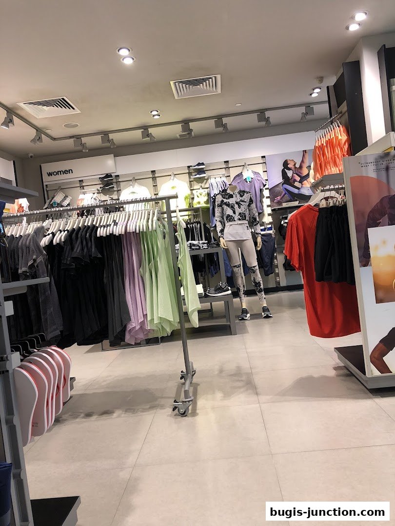 Interior view of an Adidas Performance Store showcasing women's activewear and mannequins.