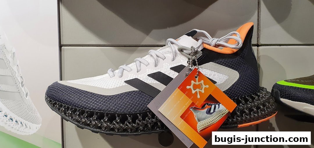 A close-up view of an Adidas running shoe with a distinctive 3D-printed sole.