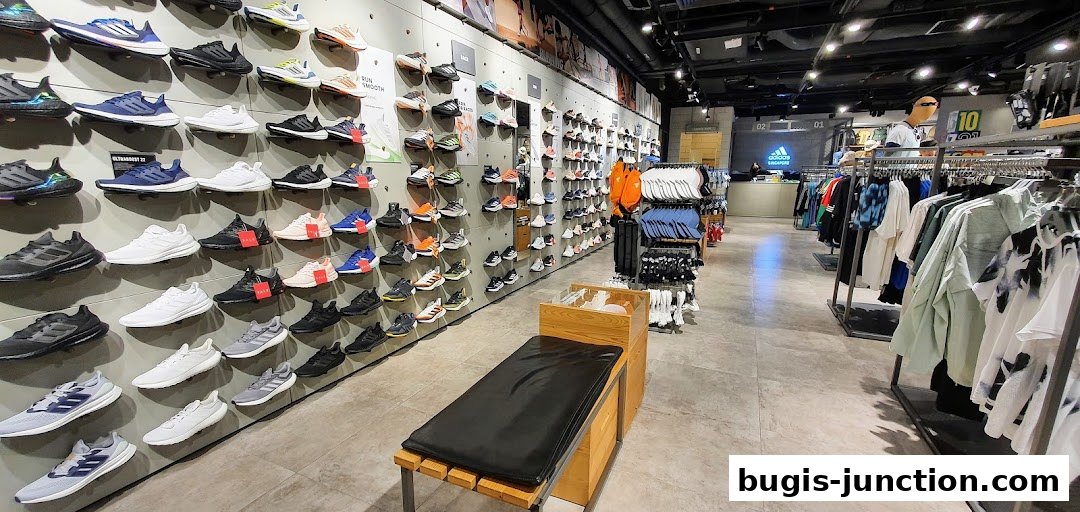 Interior view of an Adidas Performance Store showcasing a wide selection of athletic footwear and apparel.