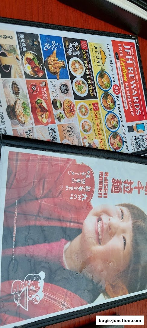 A menu featuring various ramen dishes and a promotional offer for a rewards membership.