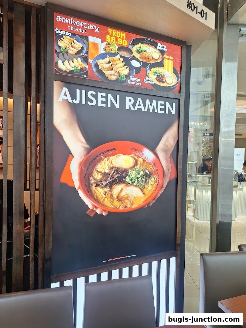 Ajisen Ramen advertisement featuring a bowl of ramen and special offers.