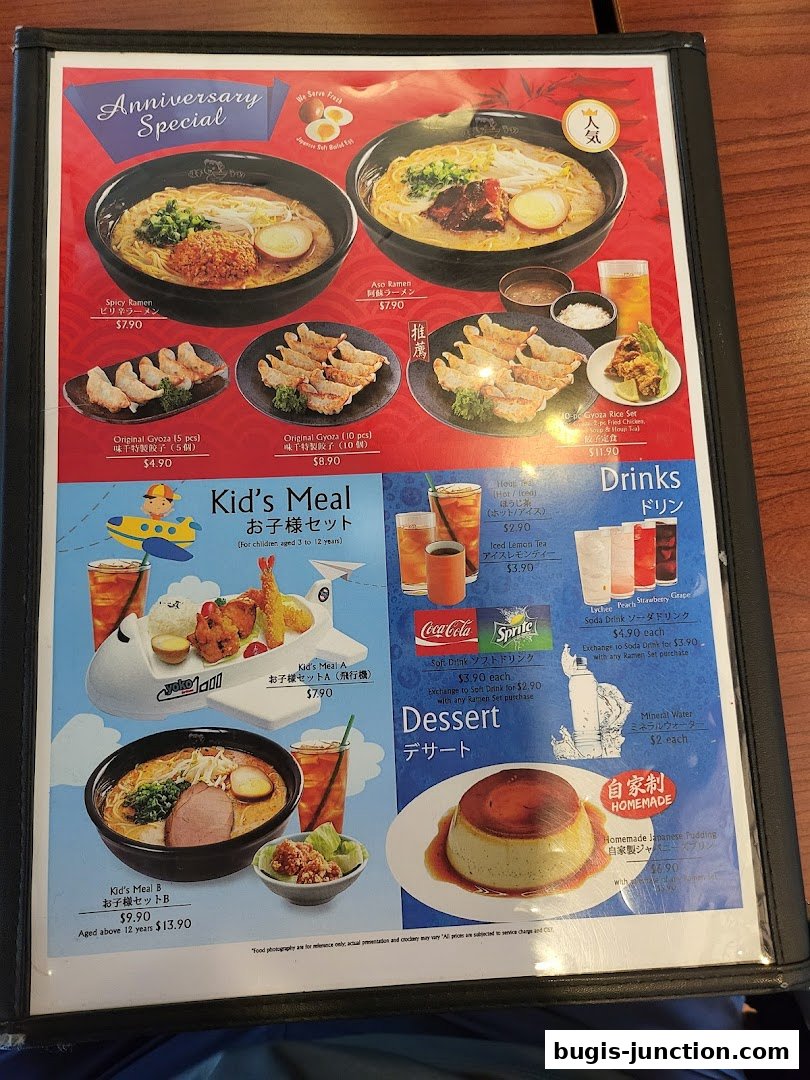 A menu from Ajisen Ramen featuring ramen, gyoza, kid's meals, drinks, and dessert.