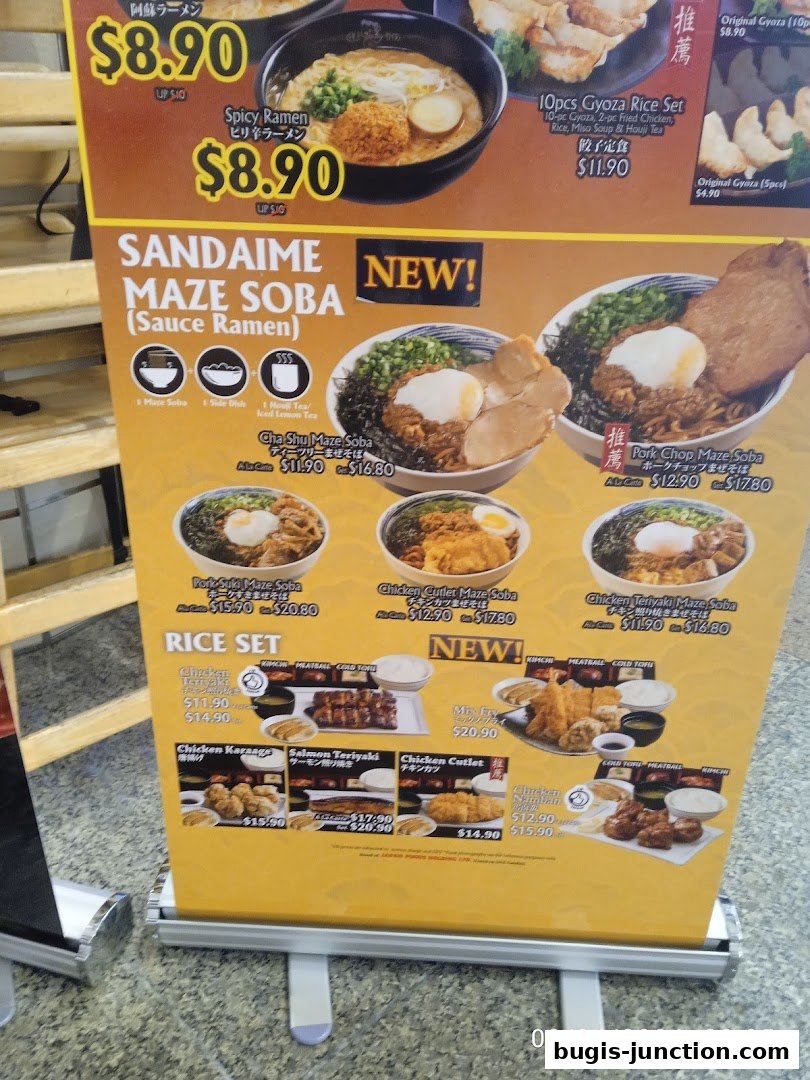 A colorful menu board showcasing various ramen and rice set dishes from Ajisen Ramen.
