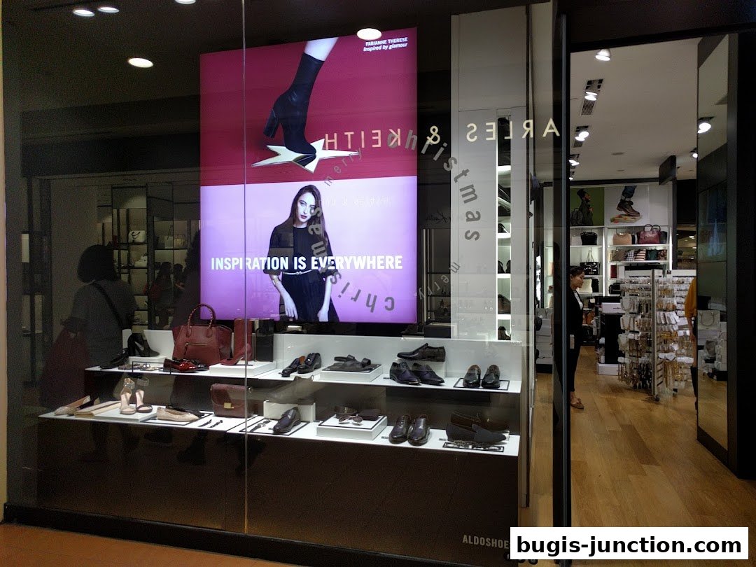 ALDO shoe store window display featuring shoes, handbags, and a fashion advertisement.