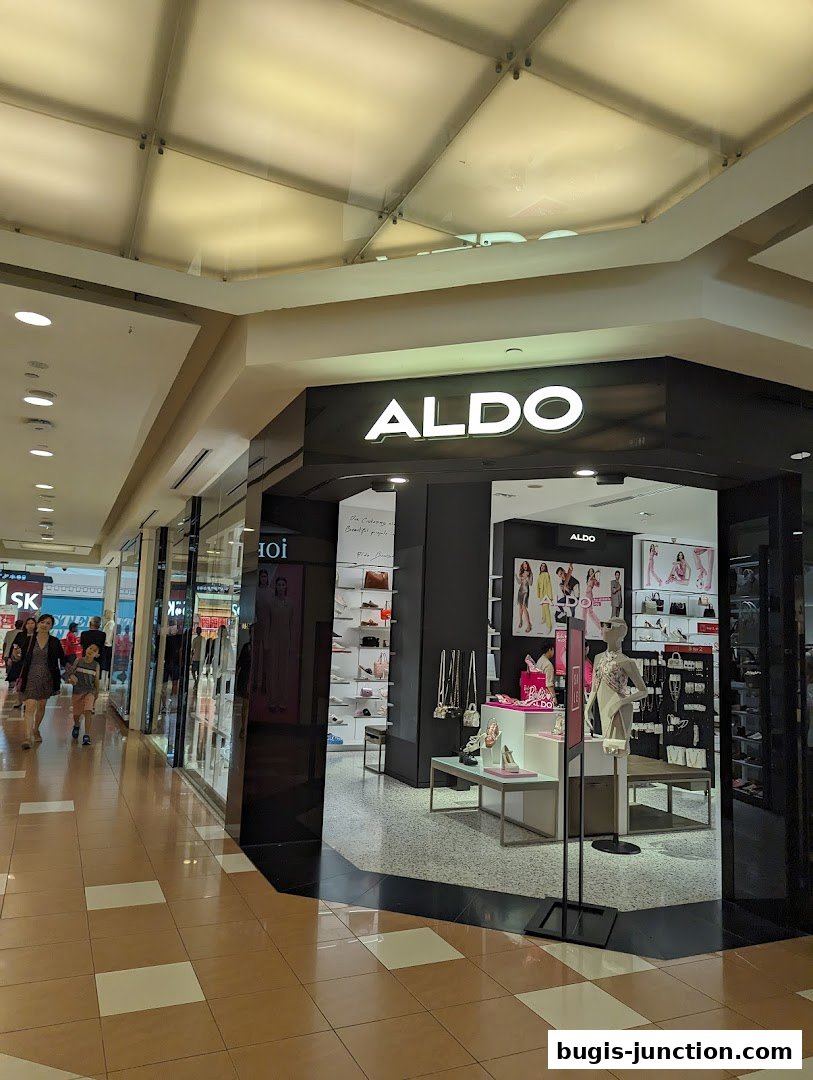 The ALDO store entrance with shoes and handbags displayed inside.
