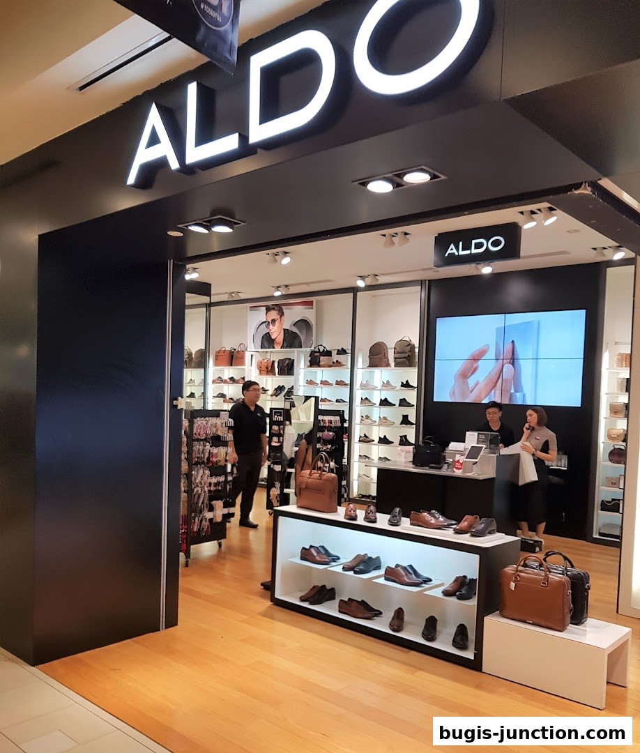 The ALDO store entrance showcases a wide selection of stylish shoes and handbags on display.