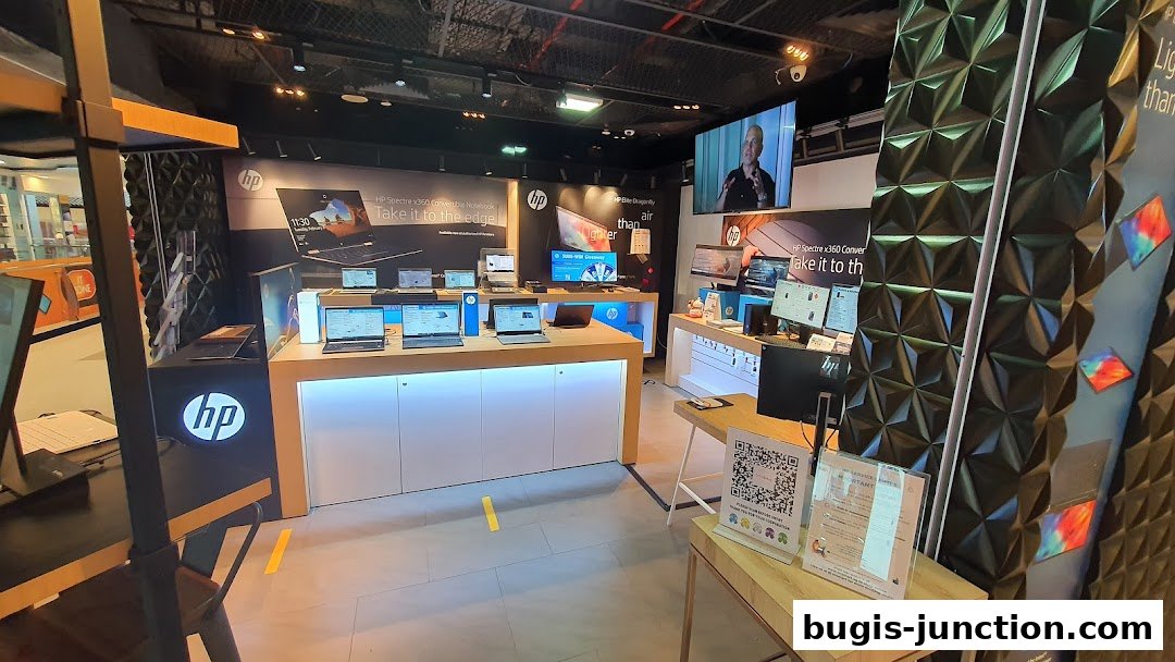 Interior of an HP store showcasing laptops and technology on display.