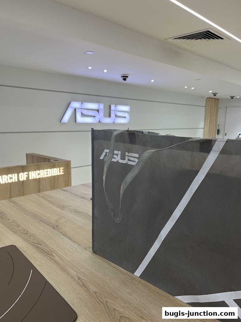 Interior shot of an ASUS store with the brand logo and a shopping bag.
