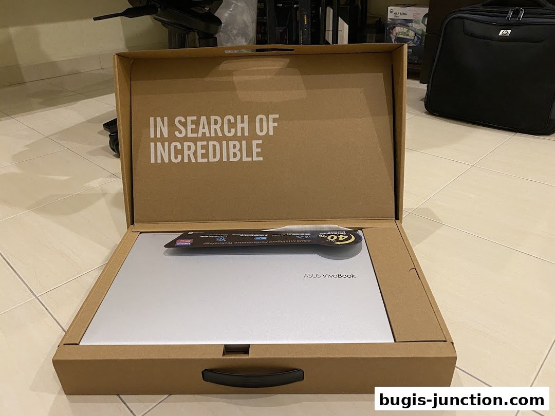 An open ASUS VivoBook laptop box with the slogan 'IN SEARCH OF INCREDIBLE'.