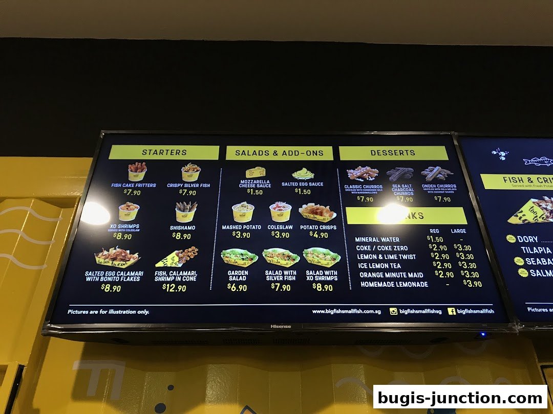 A digital menu board displaying various food items and drinks offered by Big Fish Small Fish.