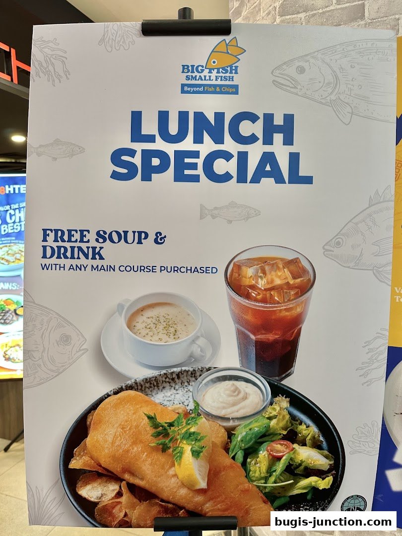 A promotional poster for Big Fish Small Fish's lunch special, featuring fish and chips with free soup and drink.
