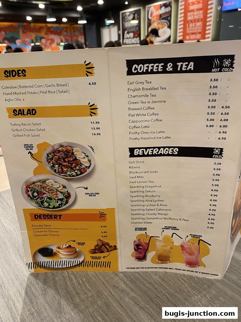 A menu from Big Fish Small Fish Bugis Junction featuring salads, sides, desserts, coffee, tea, and beverages.