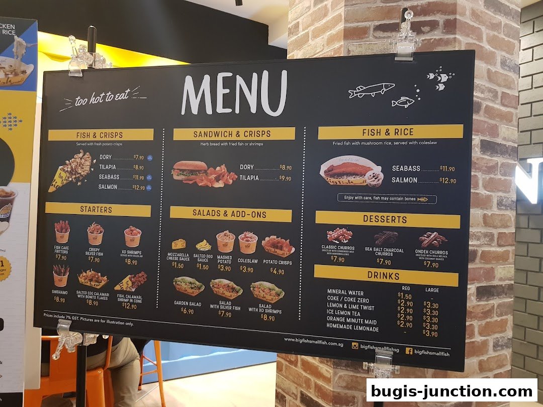 A menu board for Big Fish Small Fish restaurant, showcasing various fish dishes, starters, salads, desserts, and drinks.