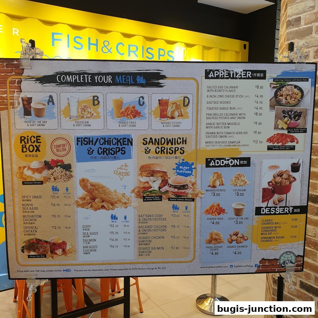 A menu board for Big Fish Small Fish Bugis Junction, featuring fish, chicken, sandwiches, and desserts.