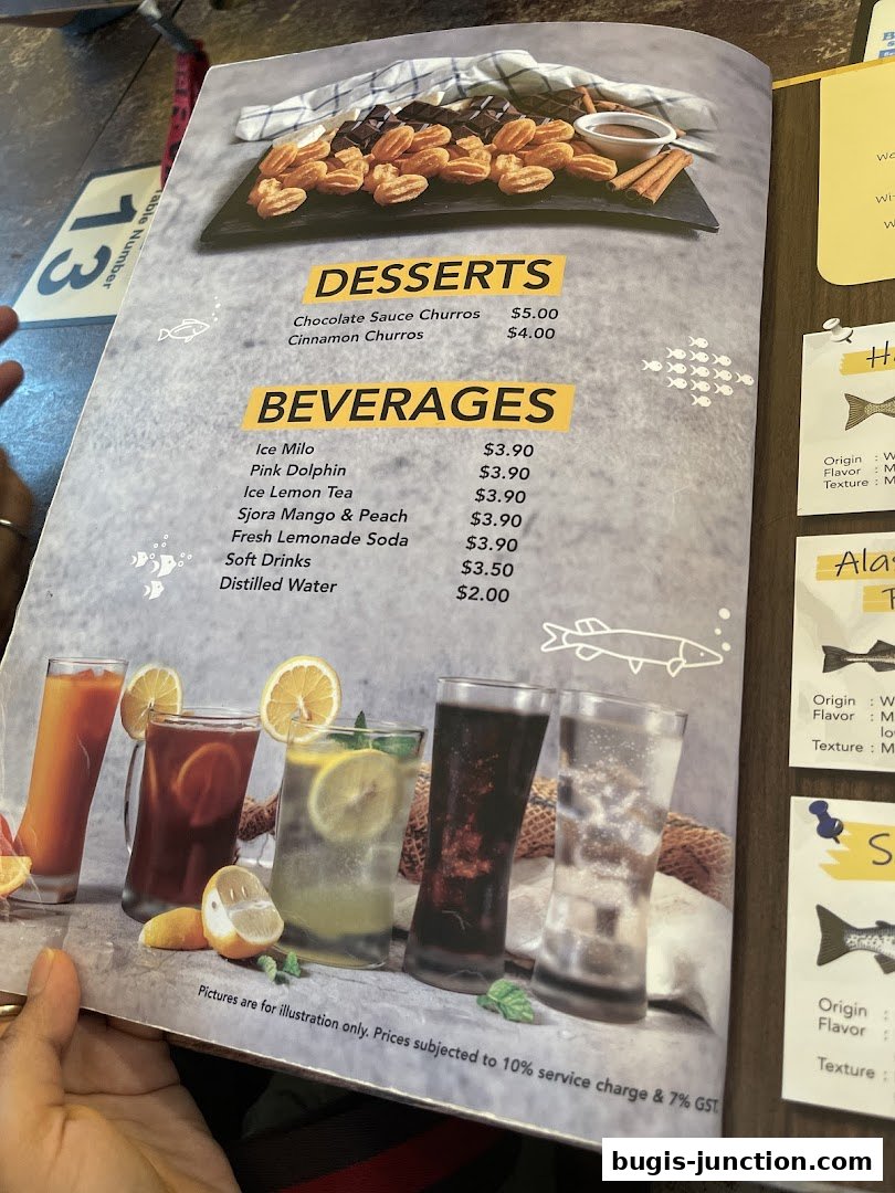 A menu from Big Fish Small Fish featuring desserts and beverages with accompanying images.