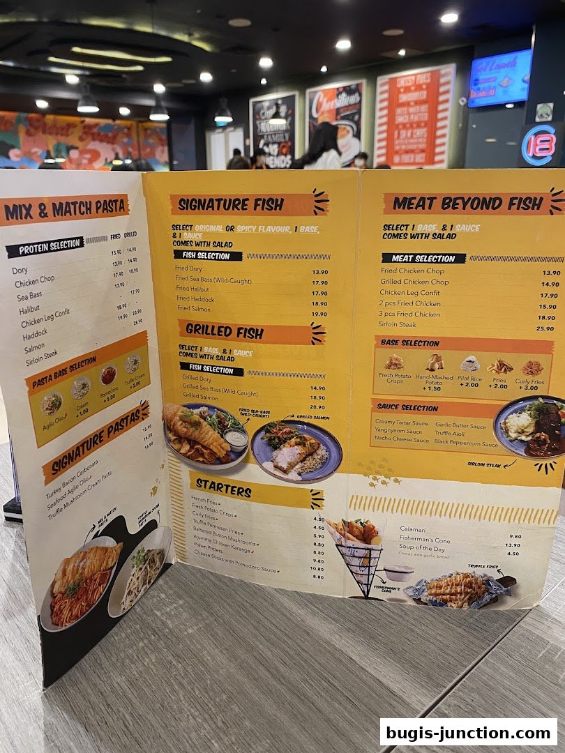 A menu from Big Fish Small Fish featuring signature fish, grilled fish, meat options, pastas, and starters.