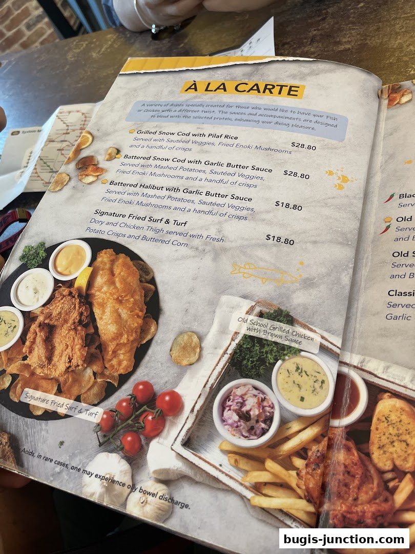 A menu from Big Fish Small Fish featuring fish and chicken dishes with sides.