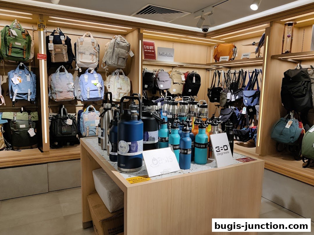 A retail shop interior displaying a variety of backpacks and water bottles.