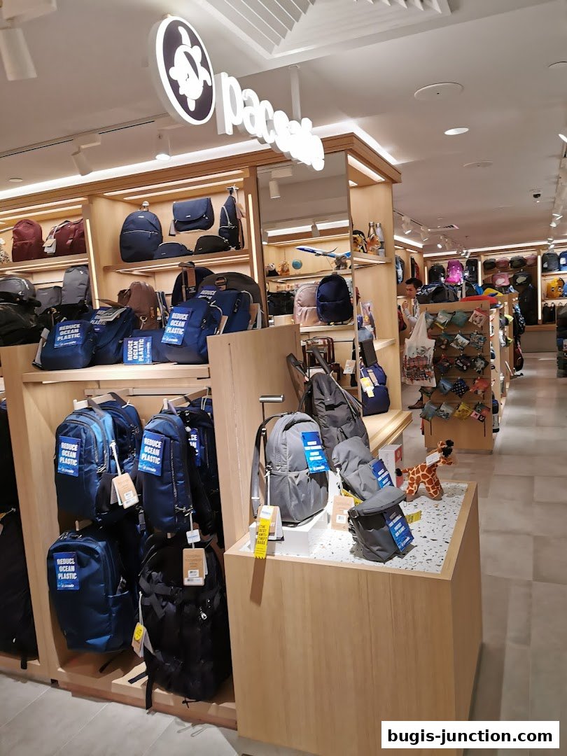 Interior view of a retail store showcasing various backpacks and bags on display.