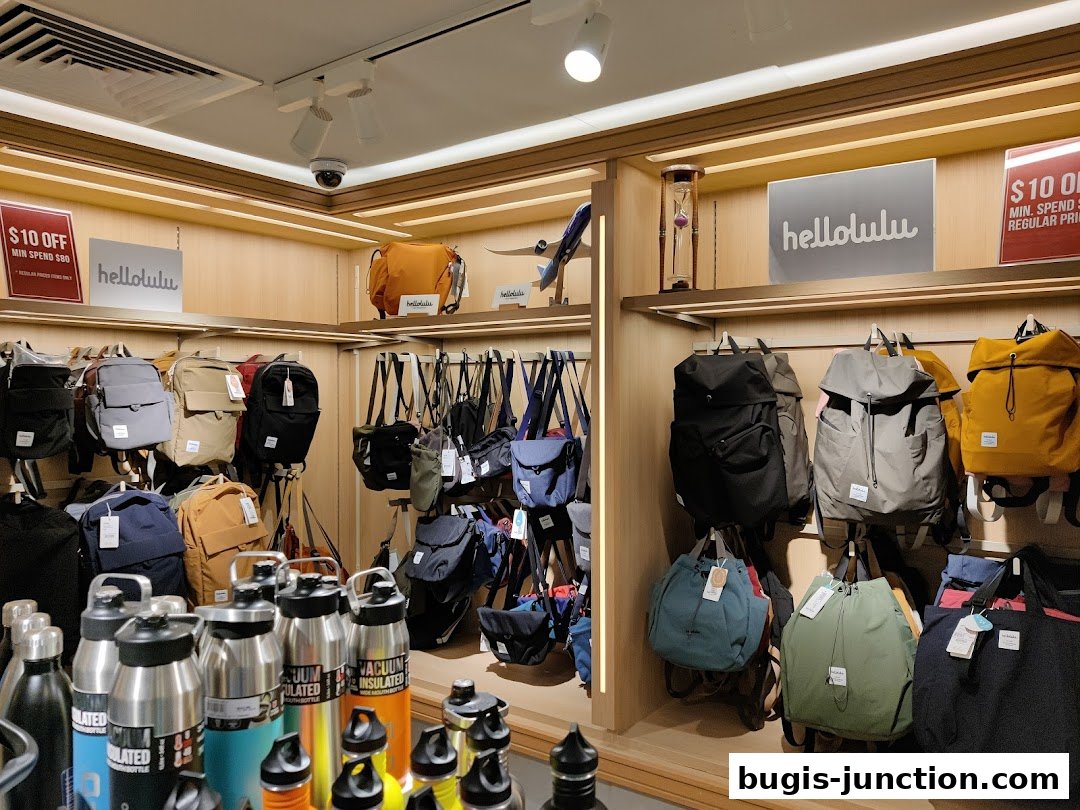 Interior view of a retail shop displaying various backpacks, bags, and water bottles.