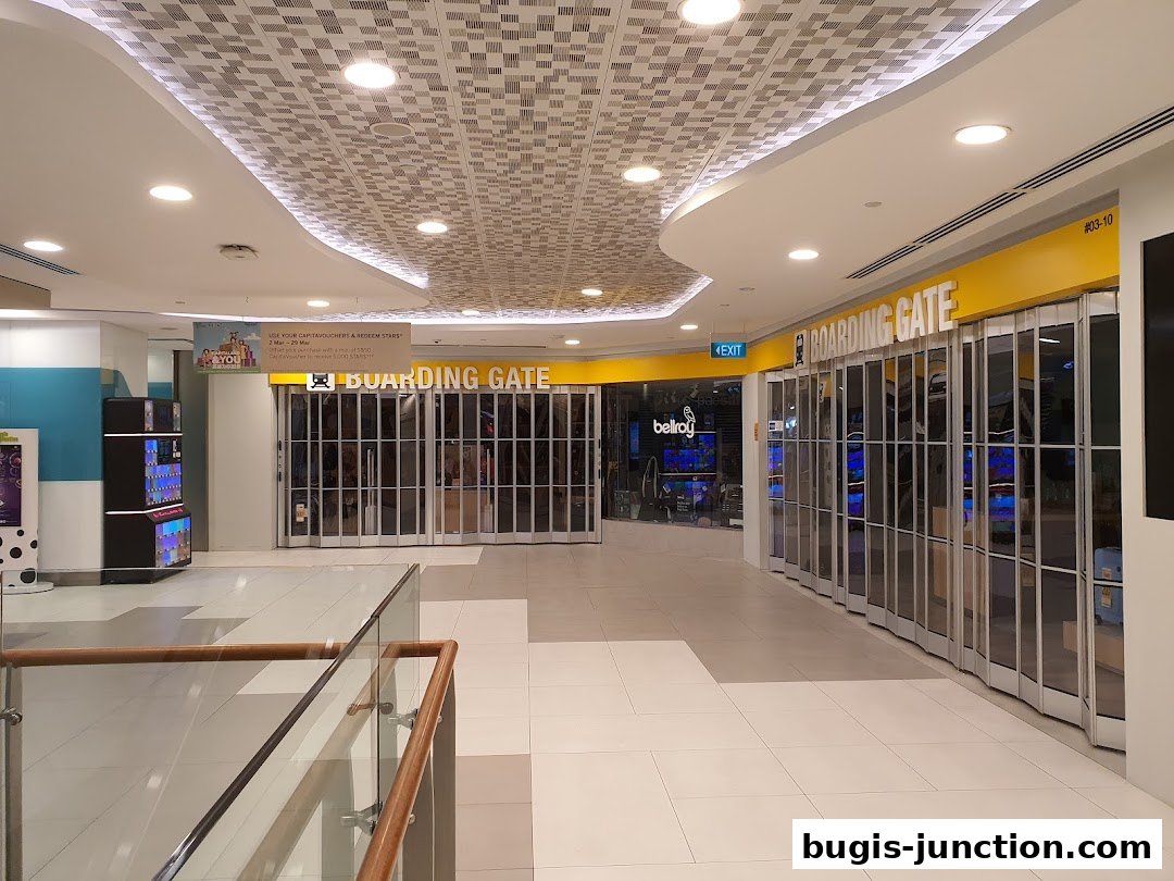 The closed storefront of a shop named "Boarding Gate" in a mall hallway.