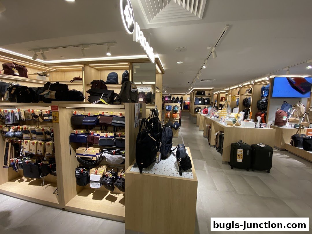 Interior view of a well-lit retail store showcasing a wide variety of bags and luggage.