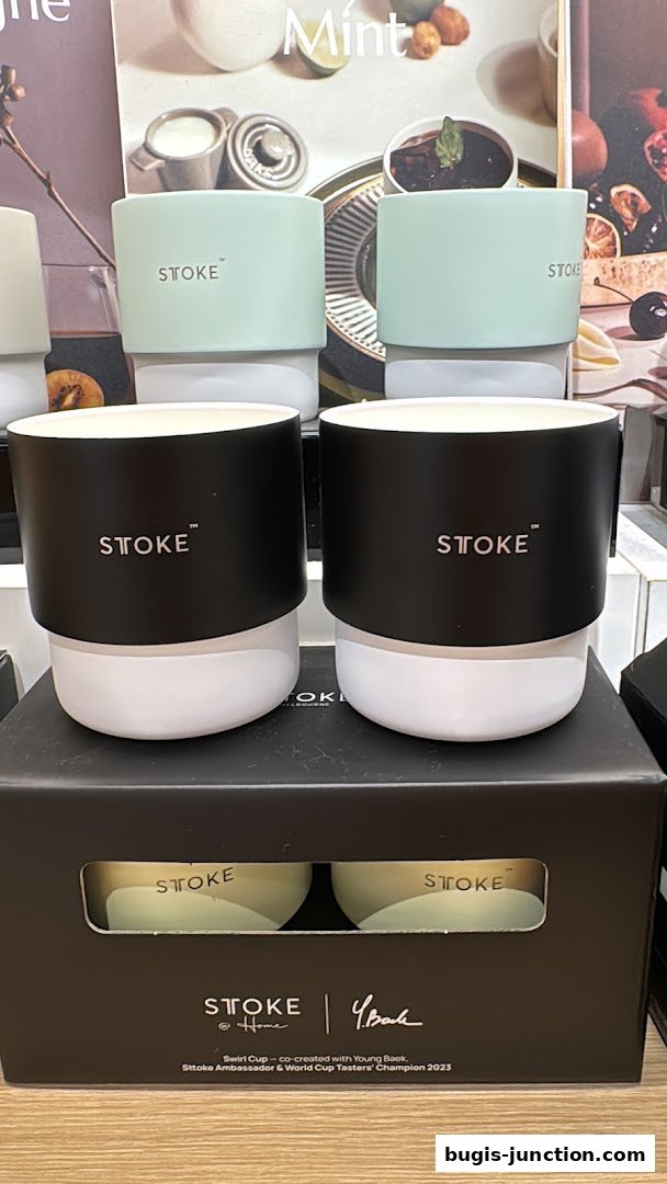 Stylish STOKE branded cups displayed in mint and black colors.
