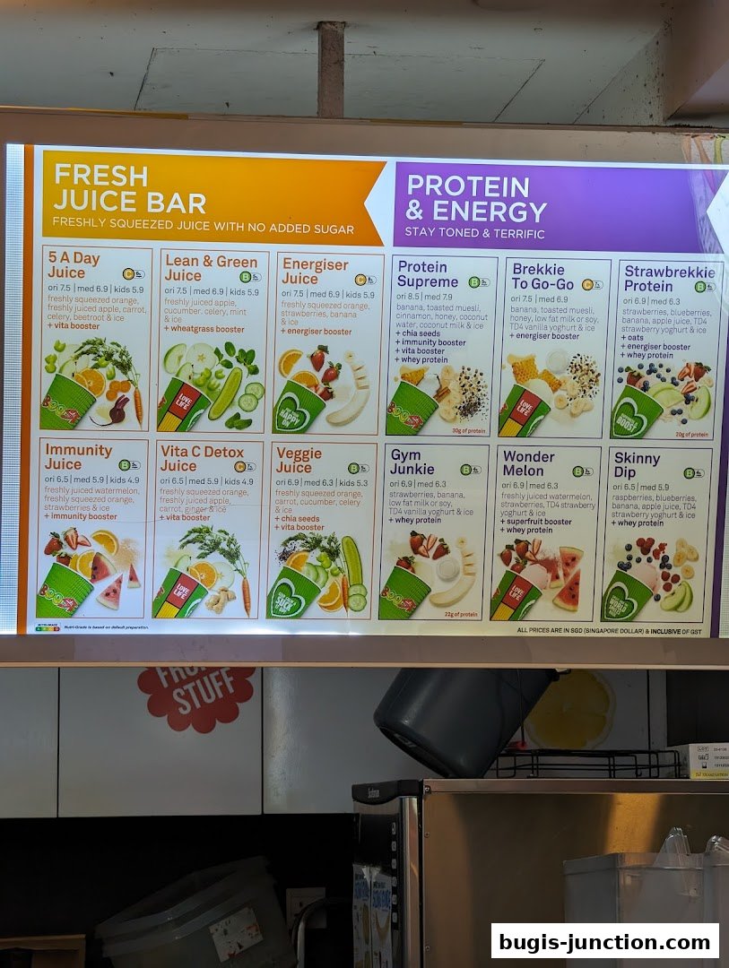 A menu board displaying various fresh juices and protein shakes with their ingredients and prices.