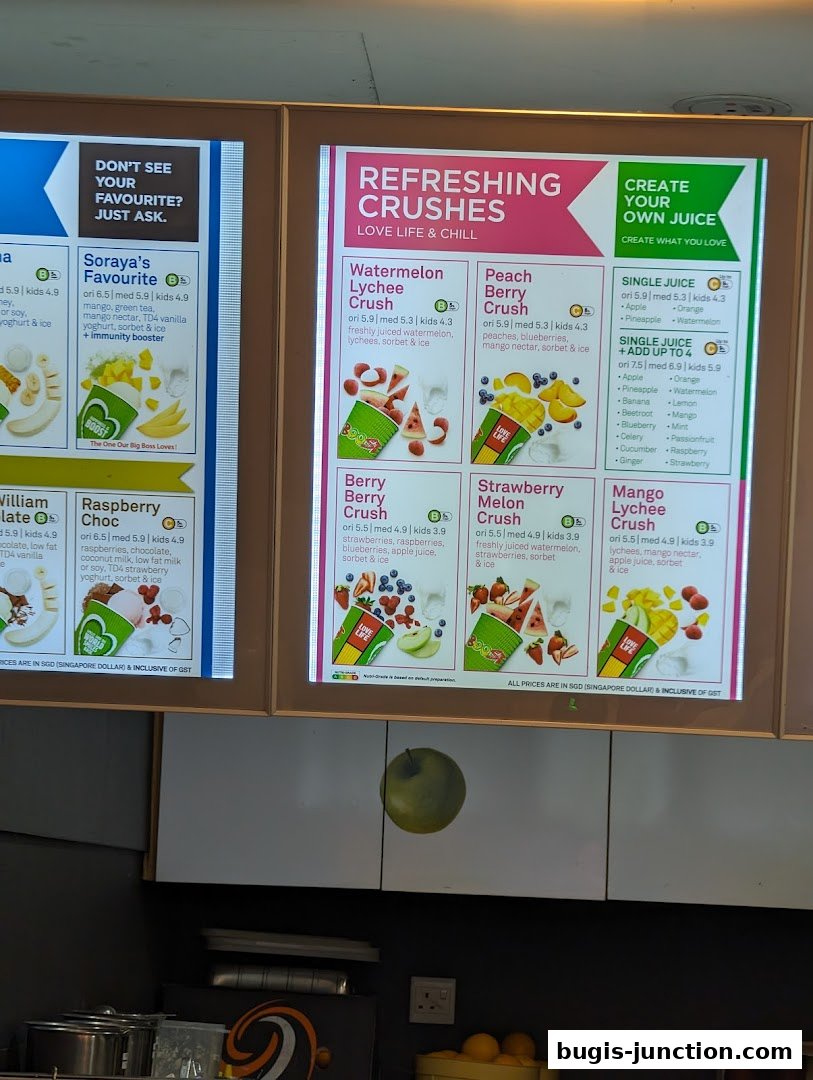 A menu board displaying various refreshing juice crushes and options to create your own juice.