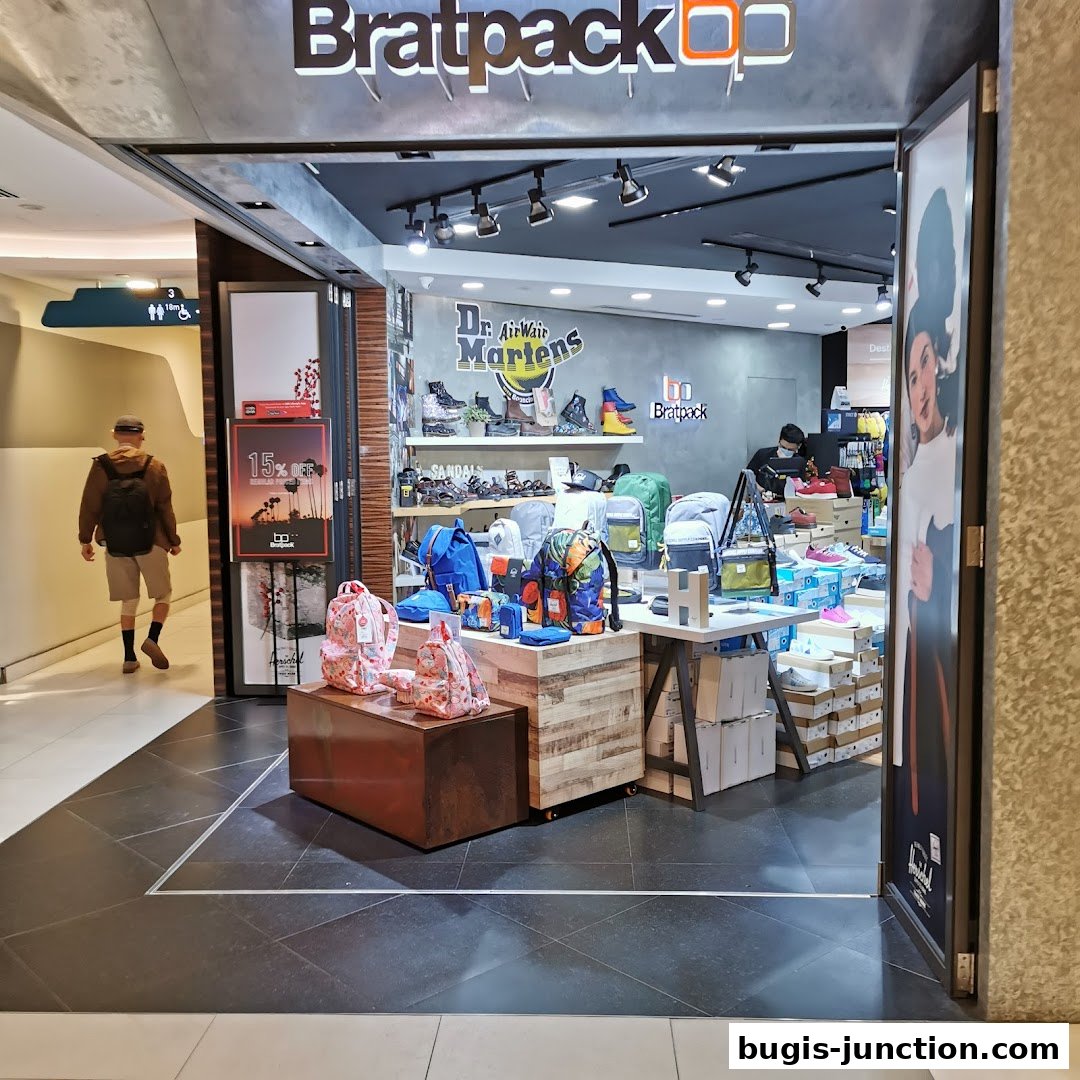 The entrance of Bratpack Bugis shop, showcasing backpacks, shoes, and accessories.