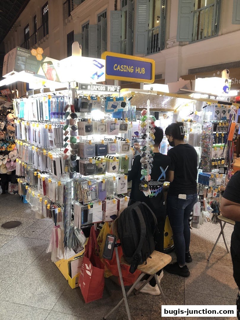 A stall named Casing Hub displays a wide variety of phone cases and accessories.