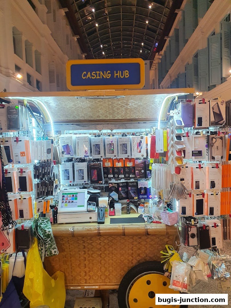A retail stall named Casing Hub displaying a wide variety of phone cases and screen protectors.