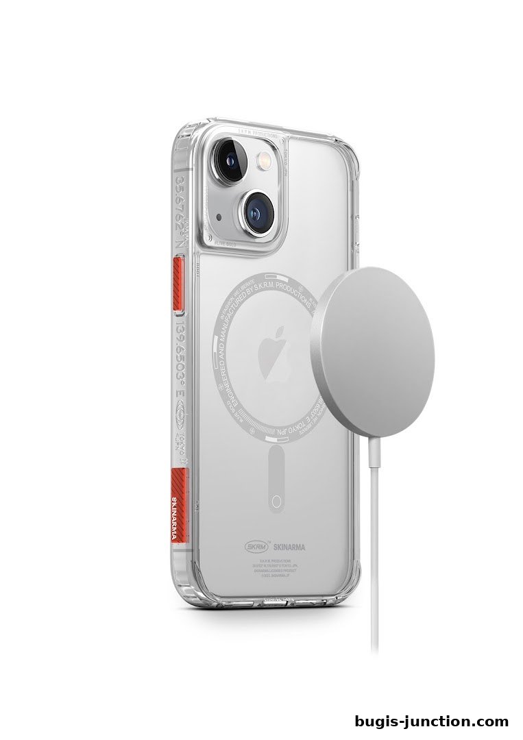 A clear phone case with a magnetic charger attached to the back of a phone.