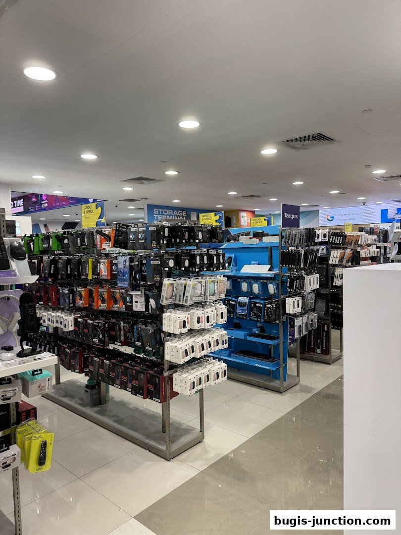 Interior view of a retail store showcasing shelves filled with mobile accessories and tech gadgets.