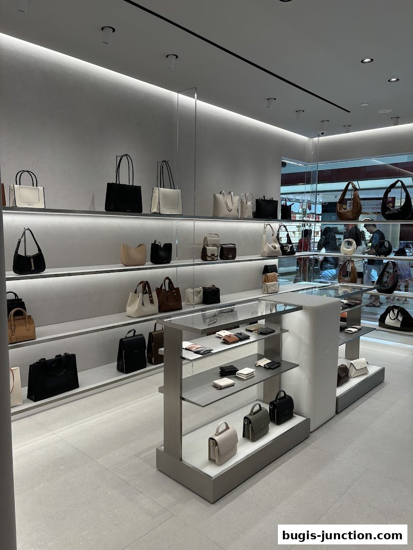 Interior view of a Charles Keith store showcasing a variety of handbags and wallets on display shelves.