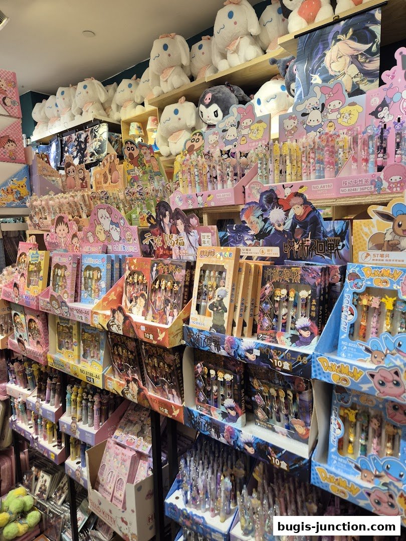 A retail shop interior filled with anime-themed merchandise, plush toys, and stationery.