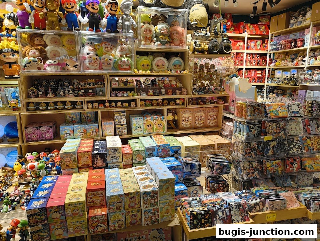 A brightly lit shop interior filled with shelves of anime figurines, plush toys, and merchandise.