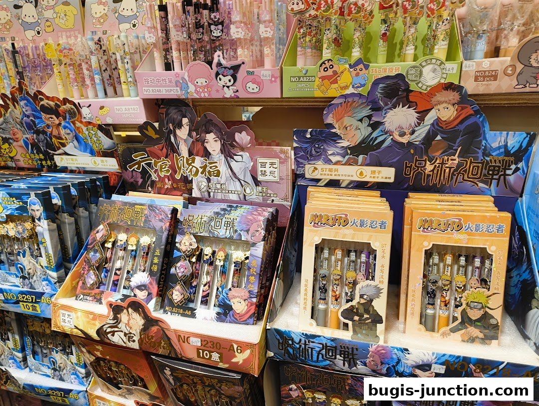 A display of anime-themed pens featuring characters from popular series like Naruto and Jujutsu Kaisen.