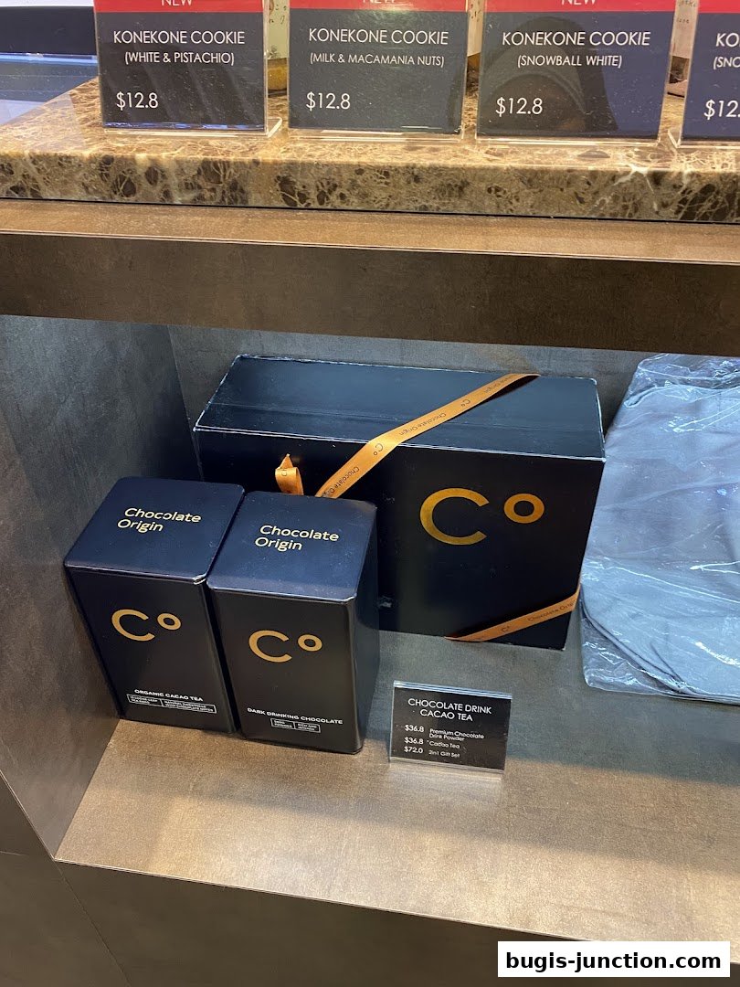Chocolate Origin shop display featuring cookies, cacao tea, and drinking chocolate.