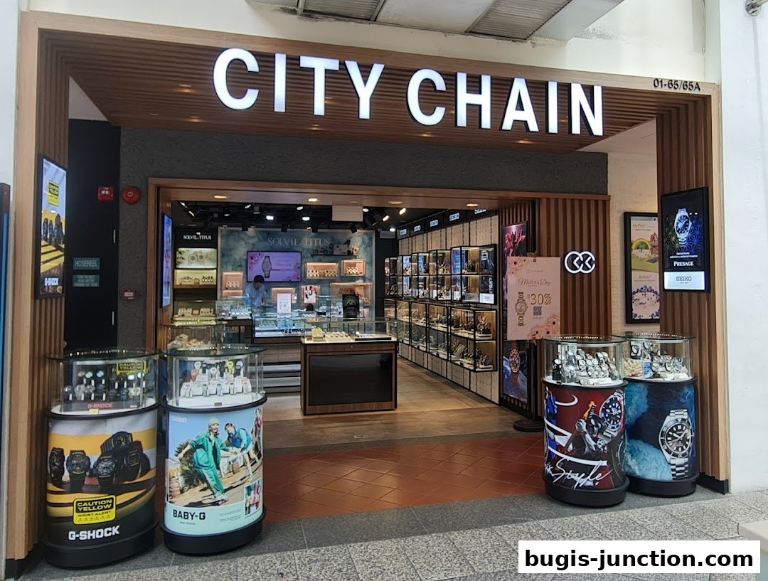 The City Chain watch store features a modern facade with illuminated signage and display cases showcasing various timepieces.