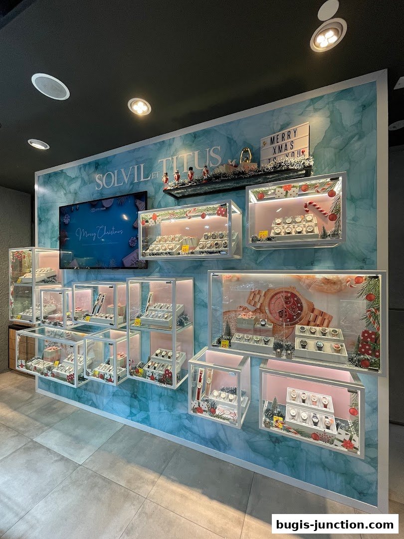 A display wall showcasing various watches with festive Christmas decorations.