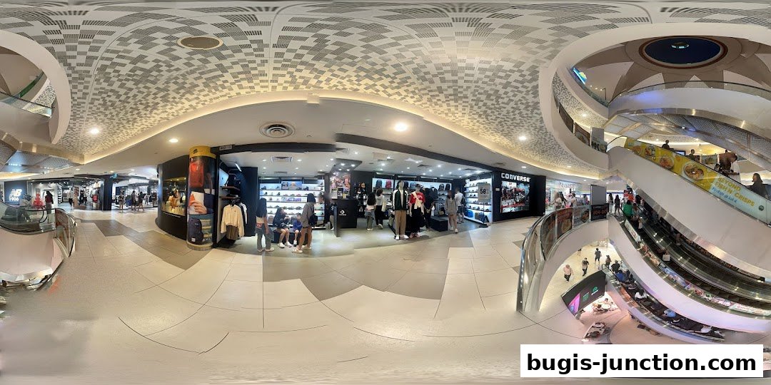 Interior view of a Converse store showcasing shoes, apparel, and mannequins.
