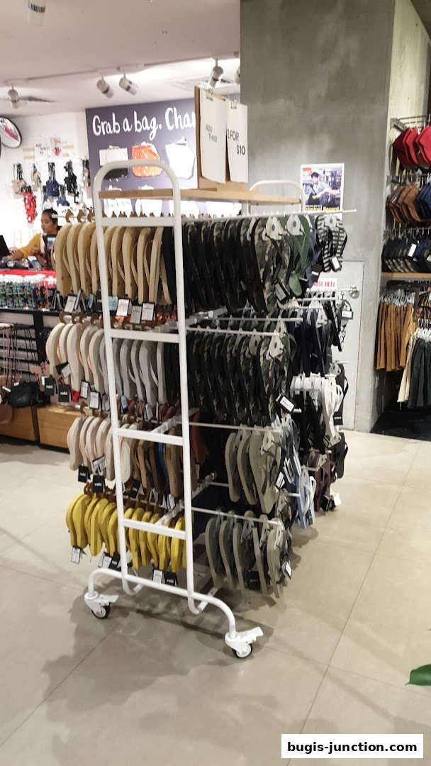 A display of flip-flops and bags inside a Cotton On RUBI store.