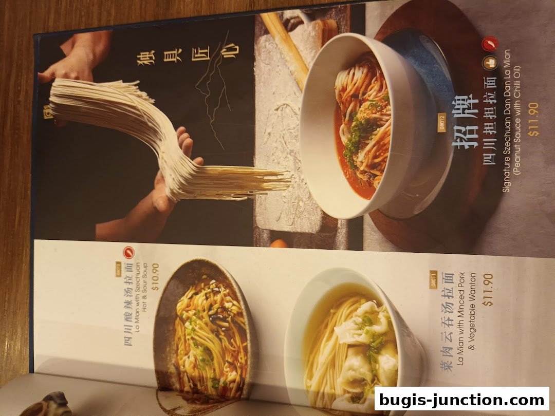 A menu featuring various noodle dishes from Crystal Jade La Mian Xiao Long Bao.