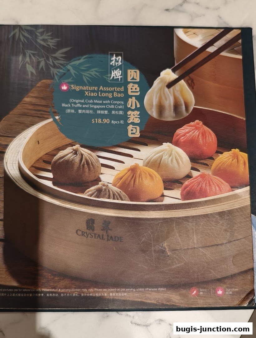 A menu featuring Crystal Jade's Signature Assorted Xiao Long Bao with four flavors.